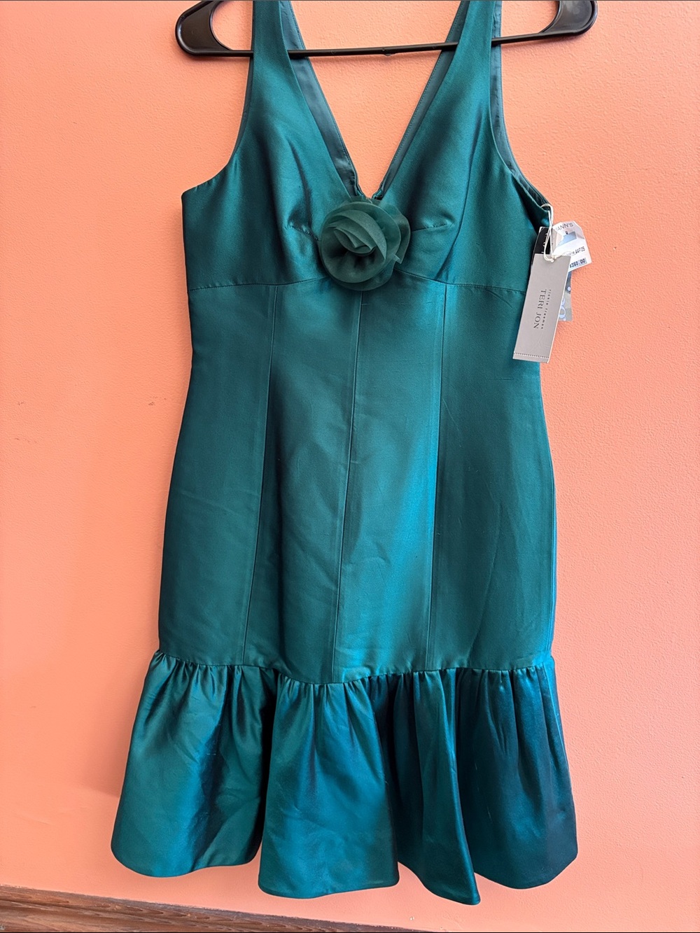 Emerald Green Ruffled Hem Dress with Floral Accent
